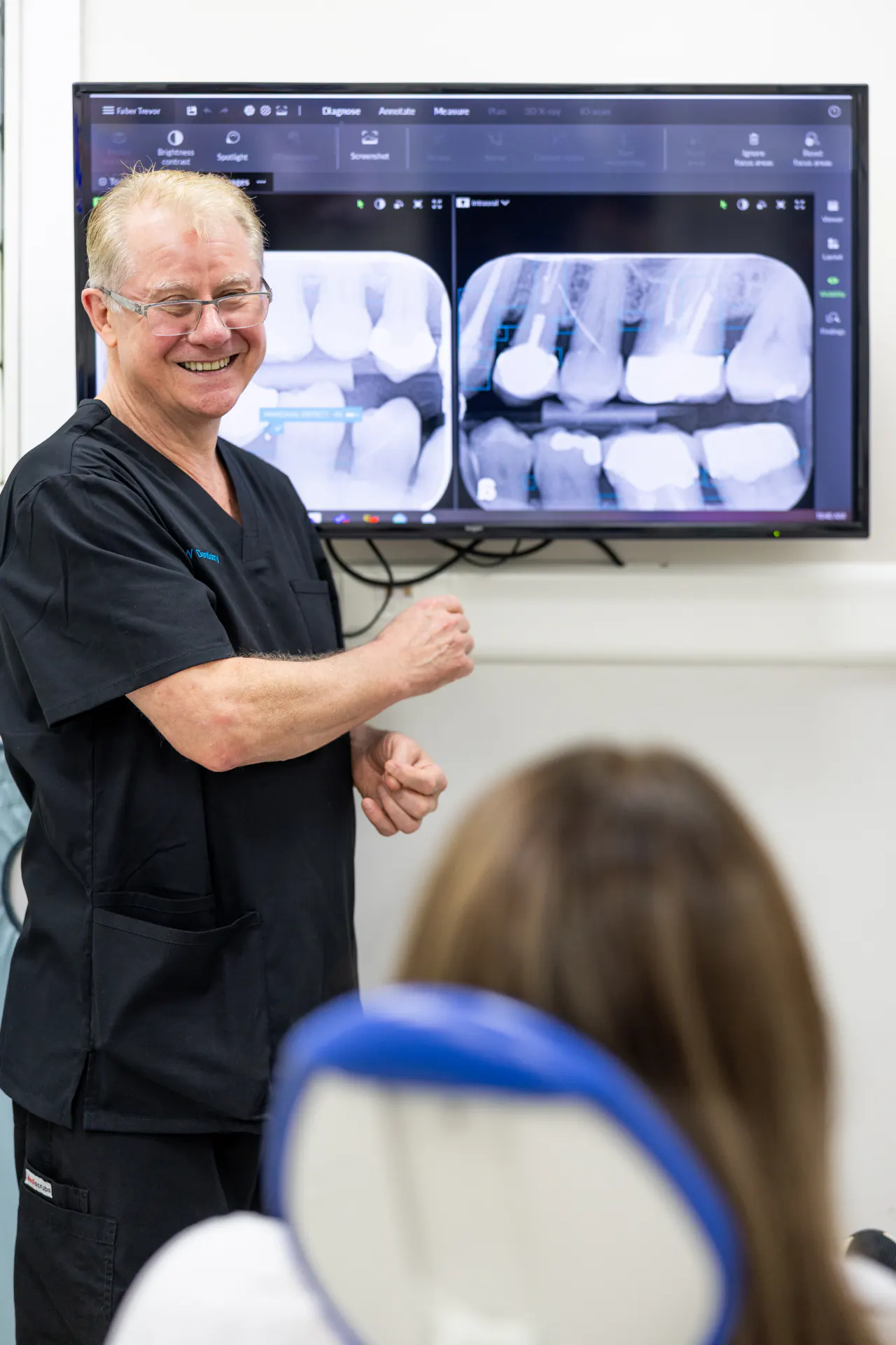 Dr Walker explaining treatment to patient