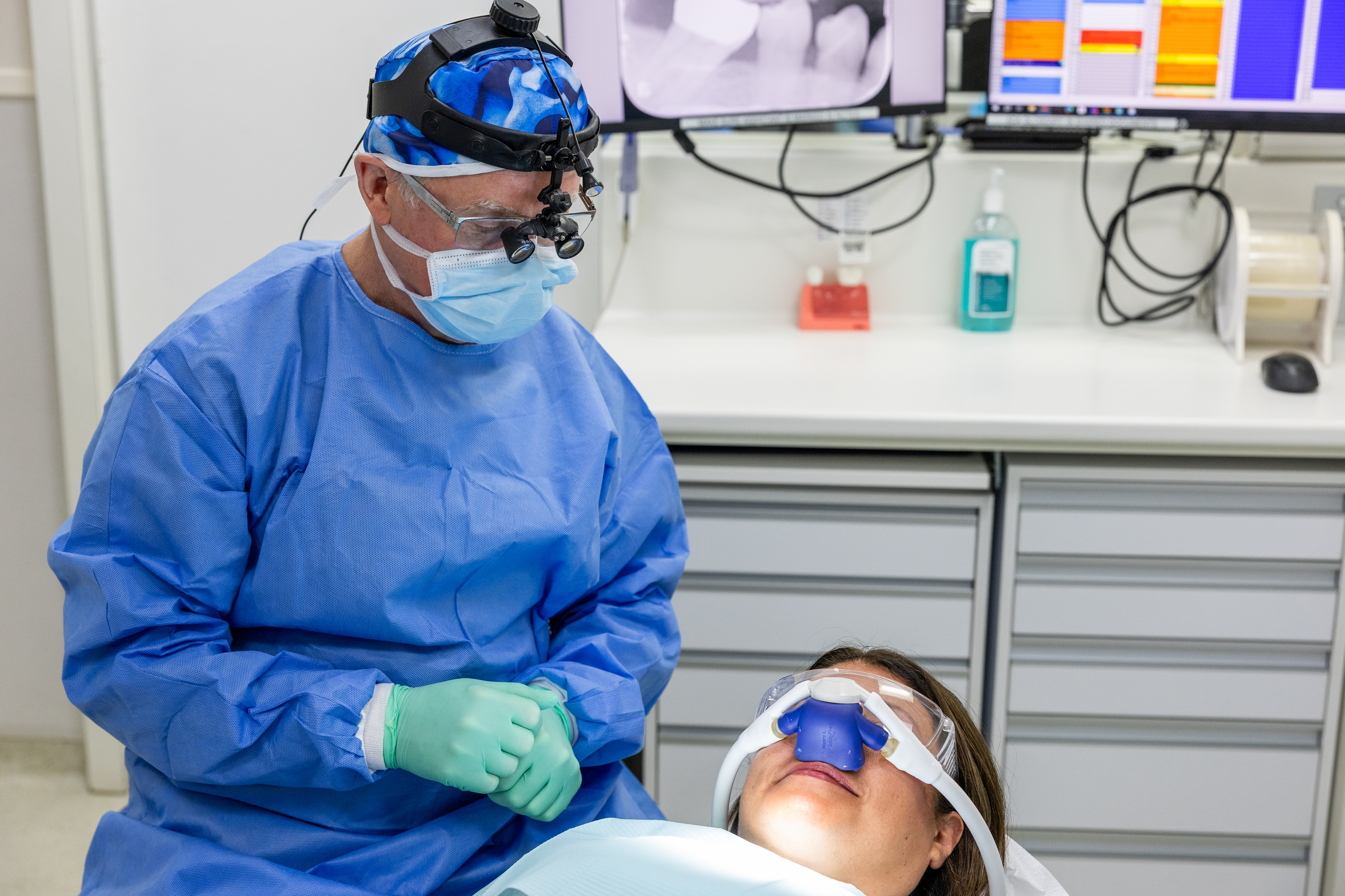 Dr Walker monitoring sedated patient